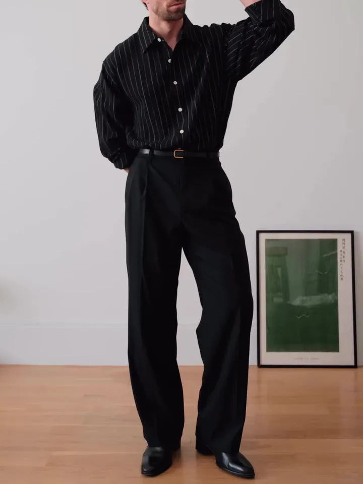 Men's black pinstriped button-down shirt showing regular fit and traditional button-down collar