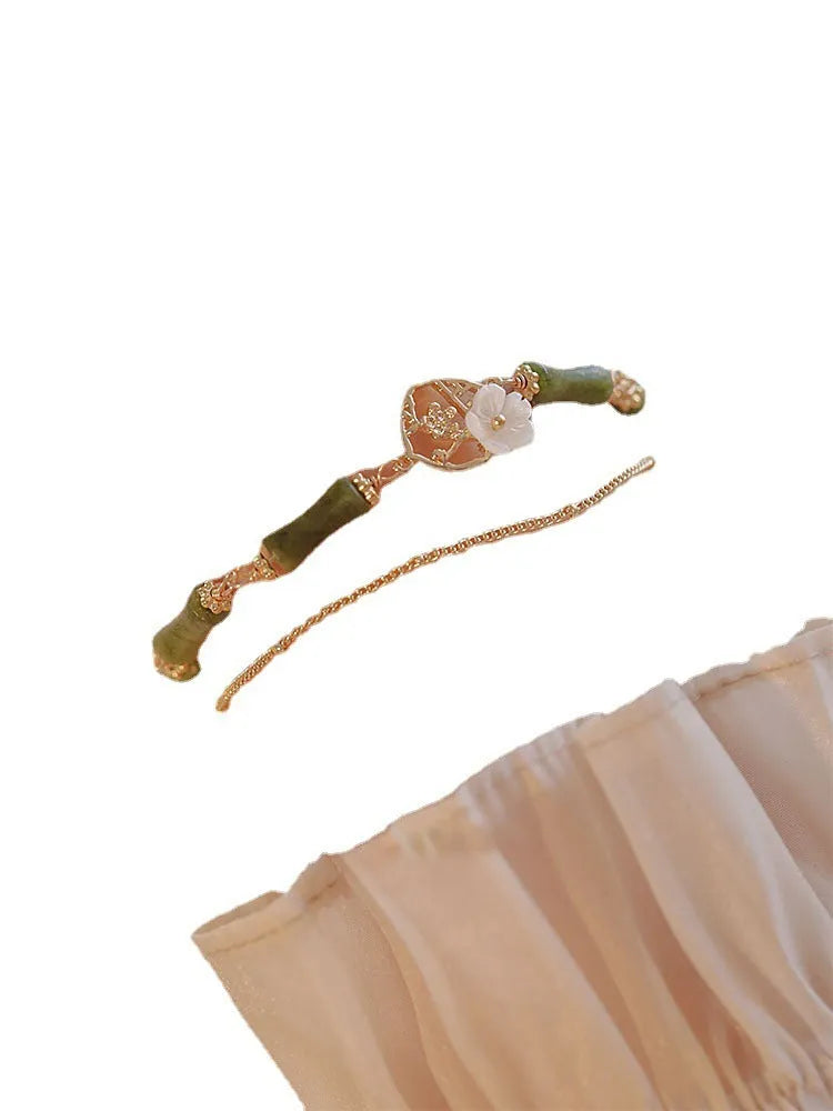 Natural olivine bracelet with Chinese double layer design featuring twin Bells of Ireland elements
