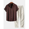 Men's casual linen blend short sleeve shirt and full-length trousers set on a hanger.