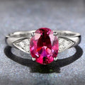 Women's court style zircon ring showing heart, water drop, and bell pattern options with red and blue stones.