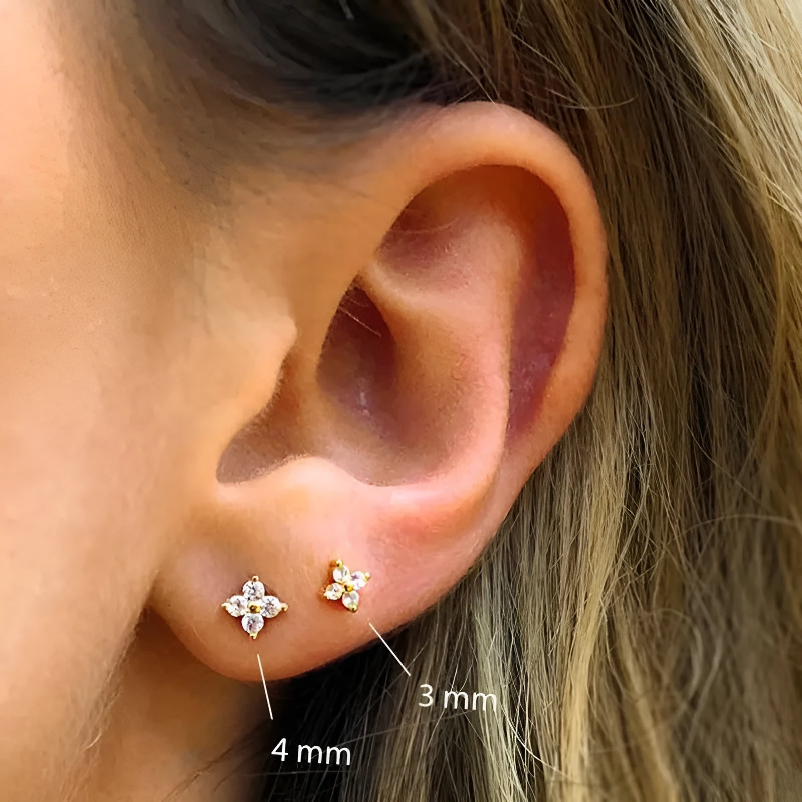 S925 sterling silver stud earrings with a geometric crystal flower design in gold or platinum plating.