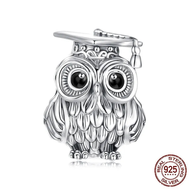 Silver S925 sterling silver owl bead with drip oil finish on white background