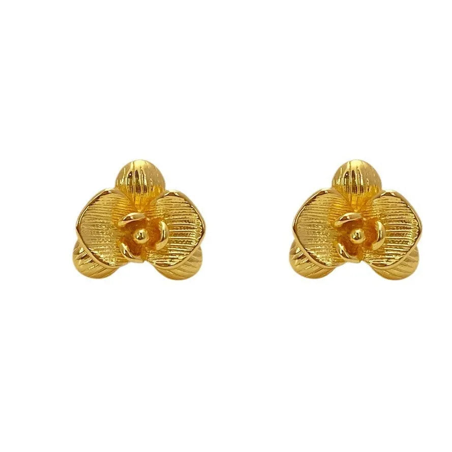 A pair of retro-style flower earrings with petal design, shown in gold electroplated finish.