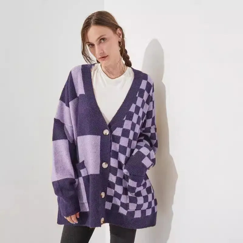 Loose fit knitwear cardigan with checks print in a selection of colours on a hanger.