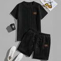 Men's black sports two-piece set with short sleeve rib T-shirt and matching shorts