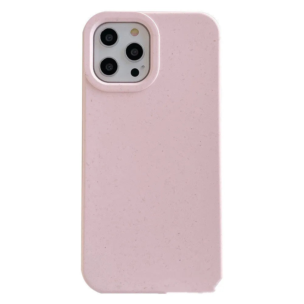 Degradable wheat straw phone case for Apple iPhone on a wooden surface.