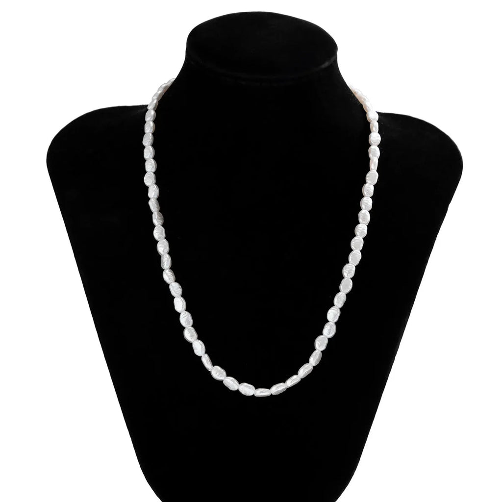 White U-shaped men's imitation pearl necklace with shellfish pendant on pearl chain.