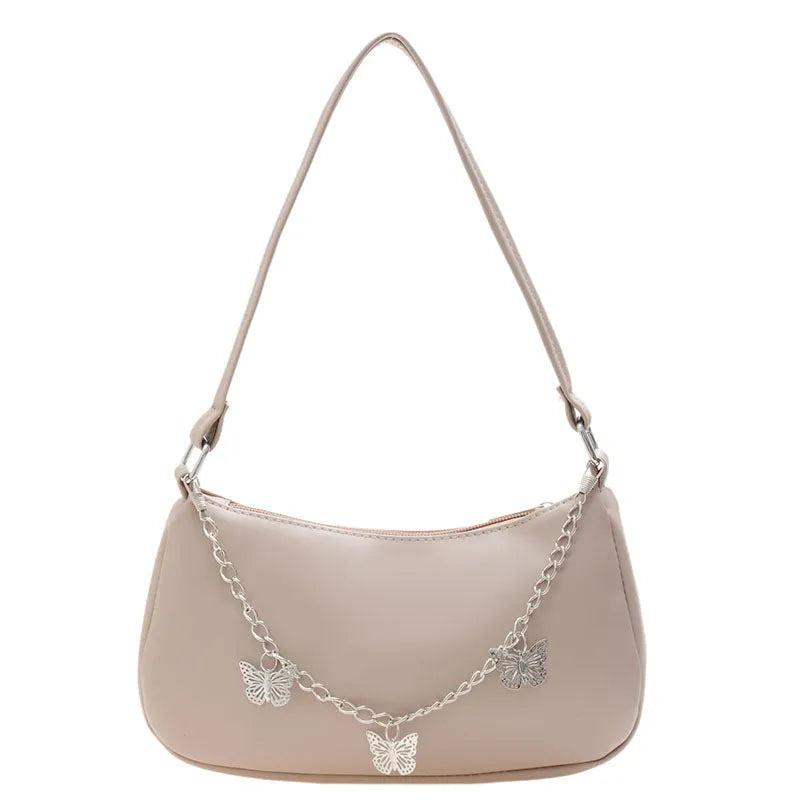 Women's black retro-style crossbody bag with chain strap and structured square shape.