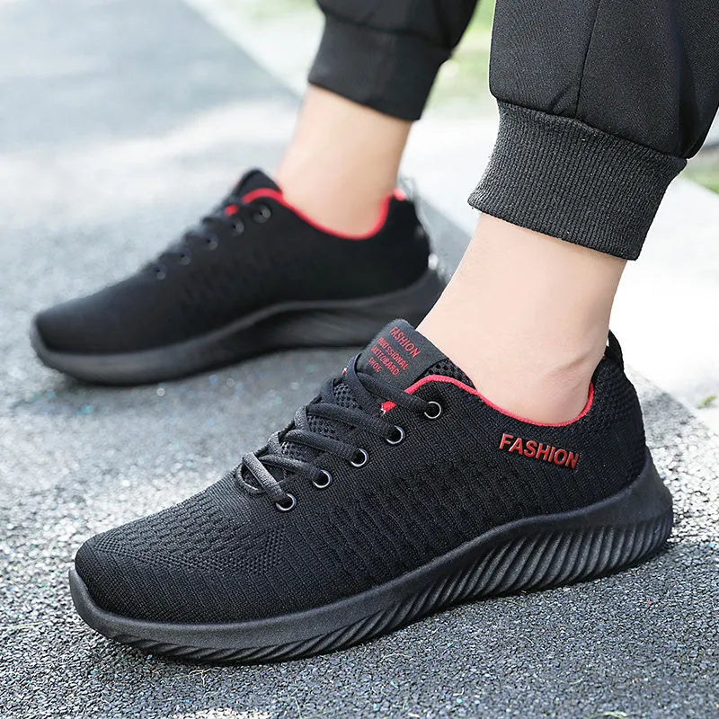 Men's lightweight breathable mesh casual sports shoes in black with white sole and lace-up closure