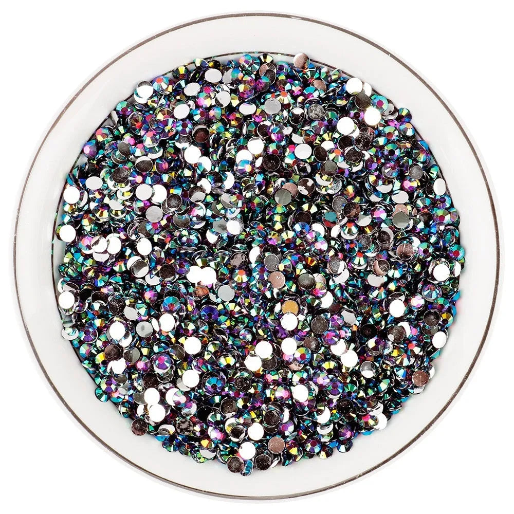 Plastic resin nail art rhinestones in multiple colours with electroplated surfaces arranged in mesh packaging