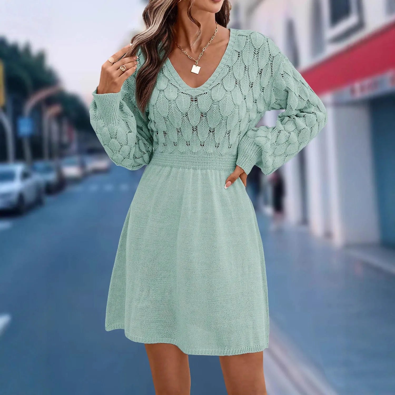 Women's apricot V-neck long sleeve dress with a 3D pattern and high waist on a mannequin.