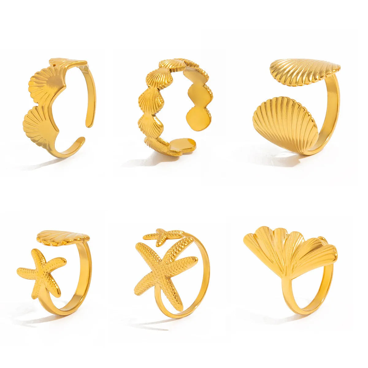 Women's irregular ocean shell ring set with starfish and fan shapes, light gold electroplated metal, 4-piece arrangement