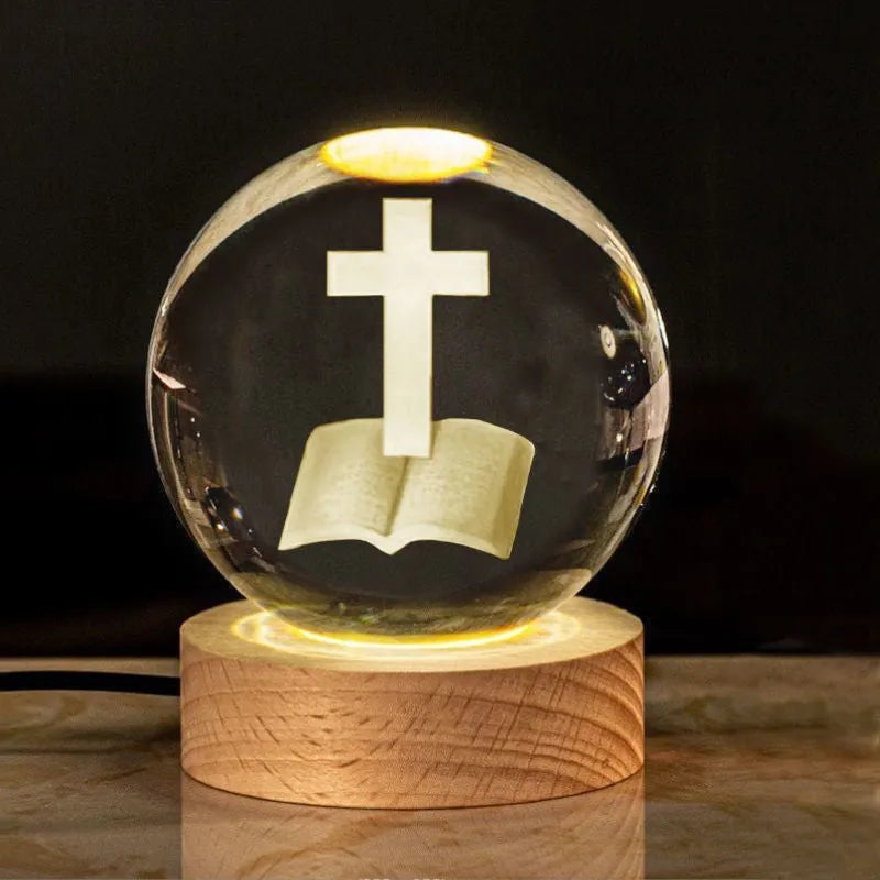 White crystal ball desk ornament with wood base and religious design inside