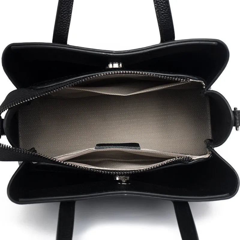 Genuine cowhide leather women's handbag in horizontal square shape with shoulder strap and organisational compartments