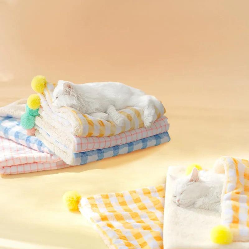 Blue coral fleece pet blanket shown laid out flat, demonstrating its soft texture and size.