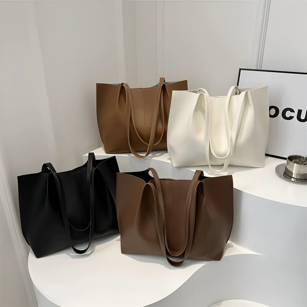 Casual messenger bag in PU leather with stitched detail, bucket shape, double shoulder straps, available in black brown coffee white