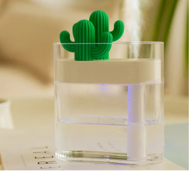 Transparent green cactus-shaped portable USB humidifier on a desk, 120mm tall