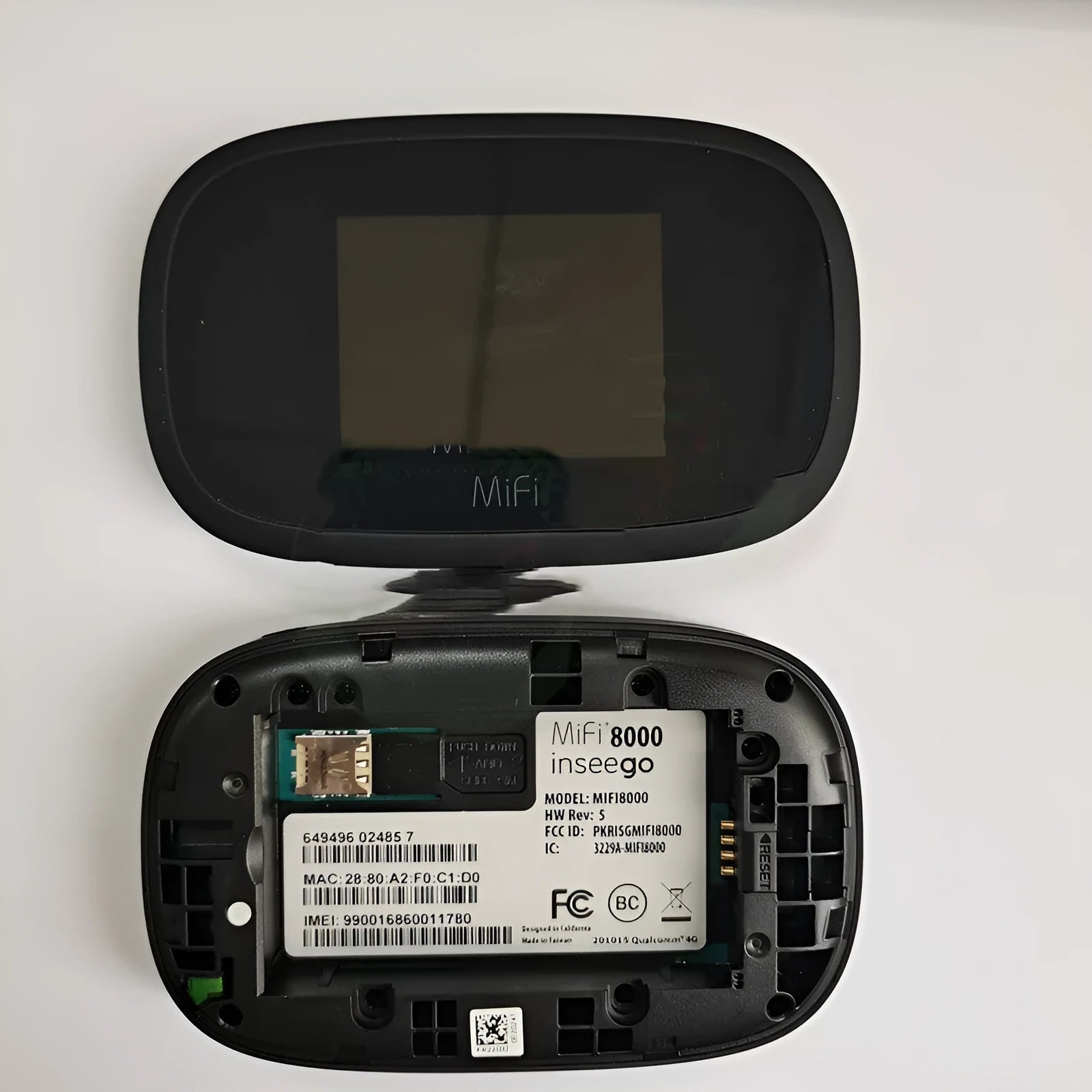 Black mifi8000 4G portable wireless router with battery and cable, showing compact size.