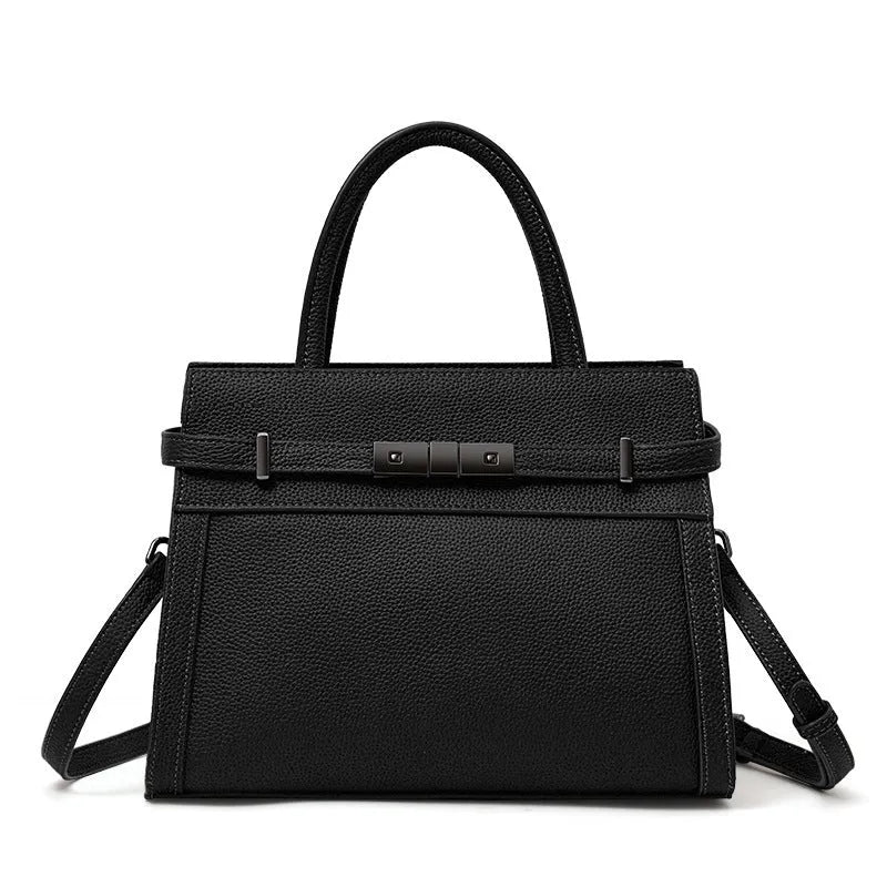 Women's genuine leather crossbody bag in horizontal square shape with clamshell opening showing internal organisation pockets