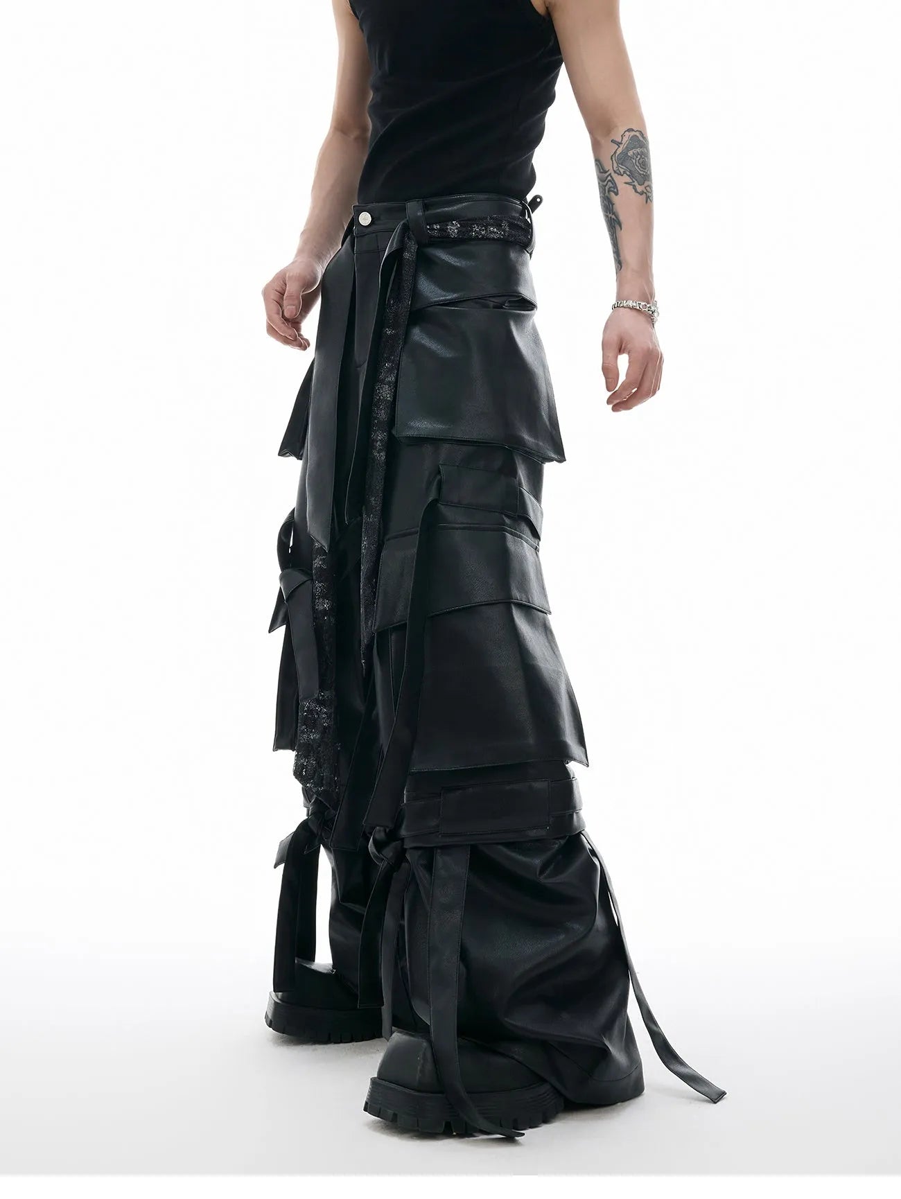 Black quilted leather pants with multiple pockets and ribbon stitching detail