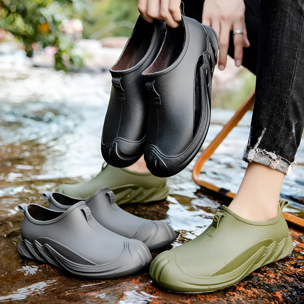 Men's solid colour short rain boots with plastic upper, shown in black, grey, and green.