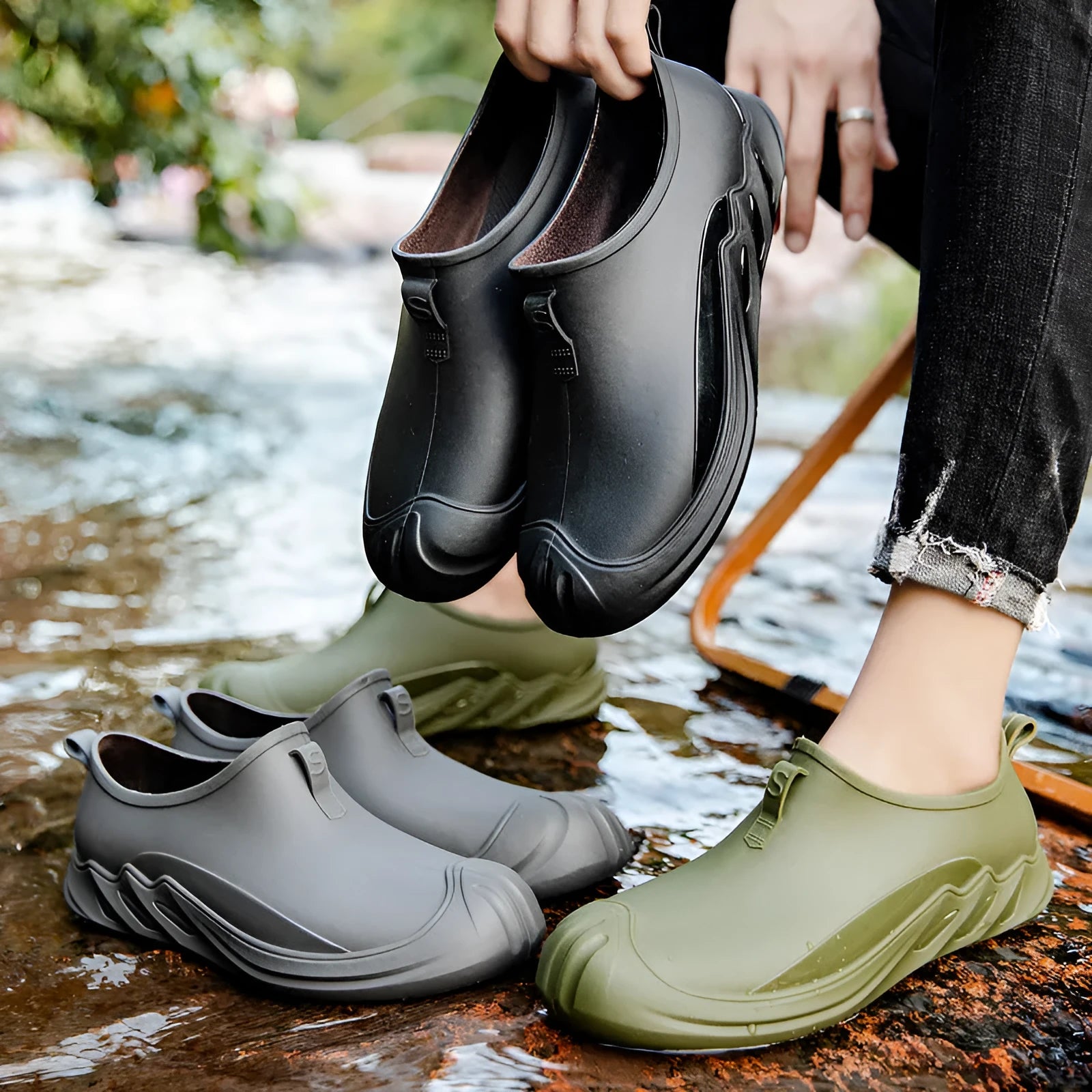 Men's solid colour short rain boots with plastic upper, shown in black, grey, and green.
