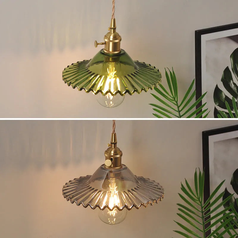 Retro copper Lotus wall lamp with a glass shade in a choice of six colours on a wall.