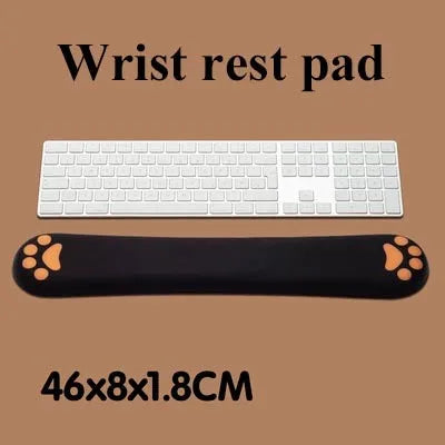 Cat's Claw cartoon design memory foam keyboard wrist rest pad in blue, shown on a desk.