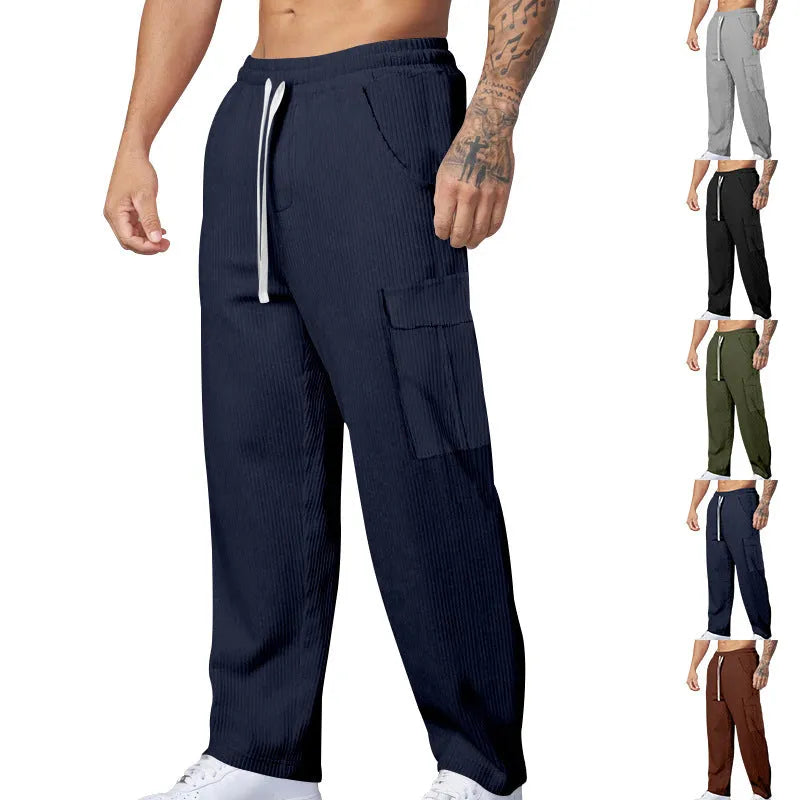 Men's loose-fitting corduroy cargo trousers in a straight-leg cut, shown in a solid colour.