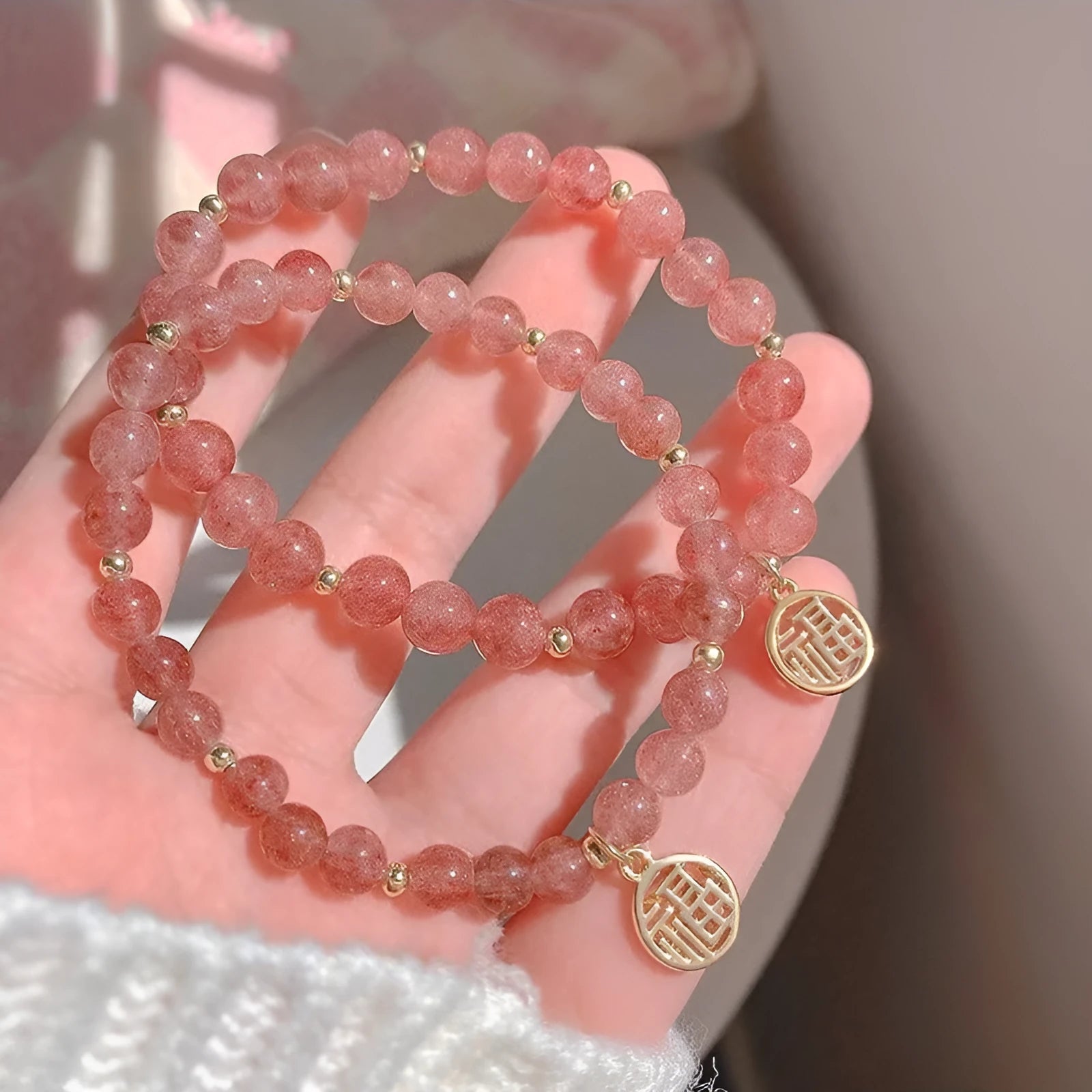 A New Chinese style glass bracelet with strawberry quartz stones and a blessing card.
