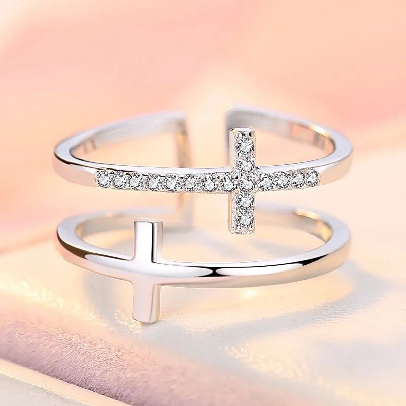 Adjustable copper ring with clear zircon stone in geometric setting, shown in gold electroplated finish