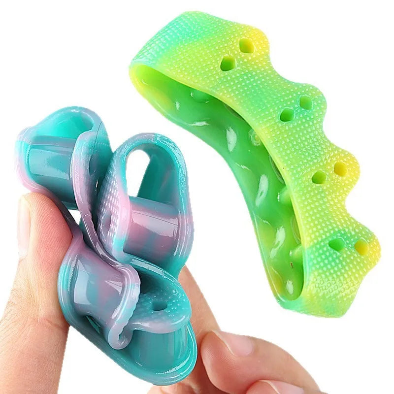 Five-hole toe separator in gradient colour made from soft SEBS material for valgus correction