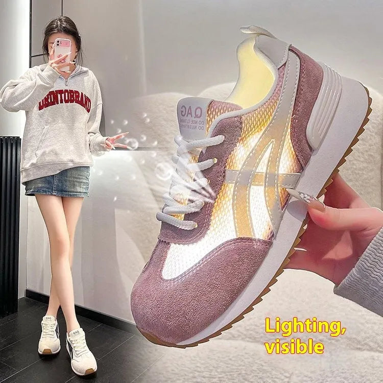 Women's white casual lace-up sneakers with round toe and non-slip sole on a plain background.