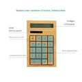 Solar bamboo calculator with natural bamboo casing and solar panel on office desk