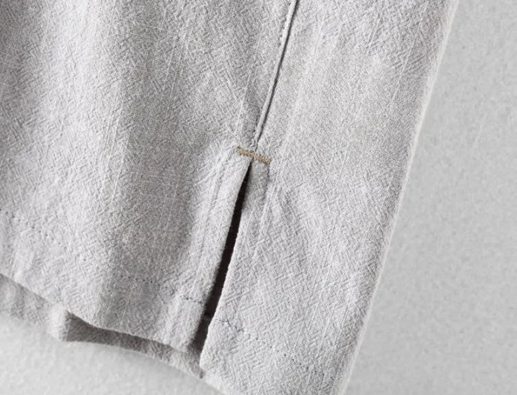 Men's loose fit linen shirt in a solid colour, shown in a light grey option.