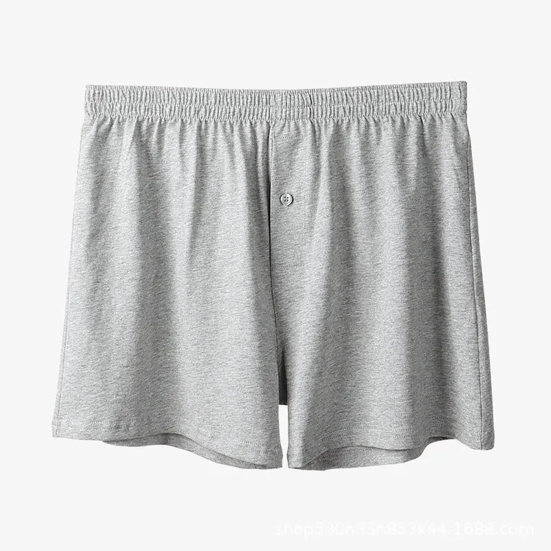Men's solid colour cotton boxer shorts on a white background, showing loose fit and high waistband.
