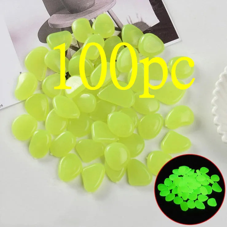 Luminous fluorescent aquarium and garden pebbles in mixed colours including dark purple, yellow, light blue, pink, orange