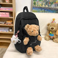 Nylon school backpack in macaron colours with curved shoulder straps and 20-35L capacity