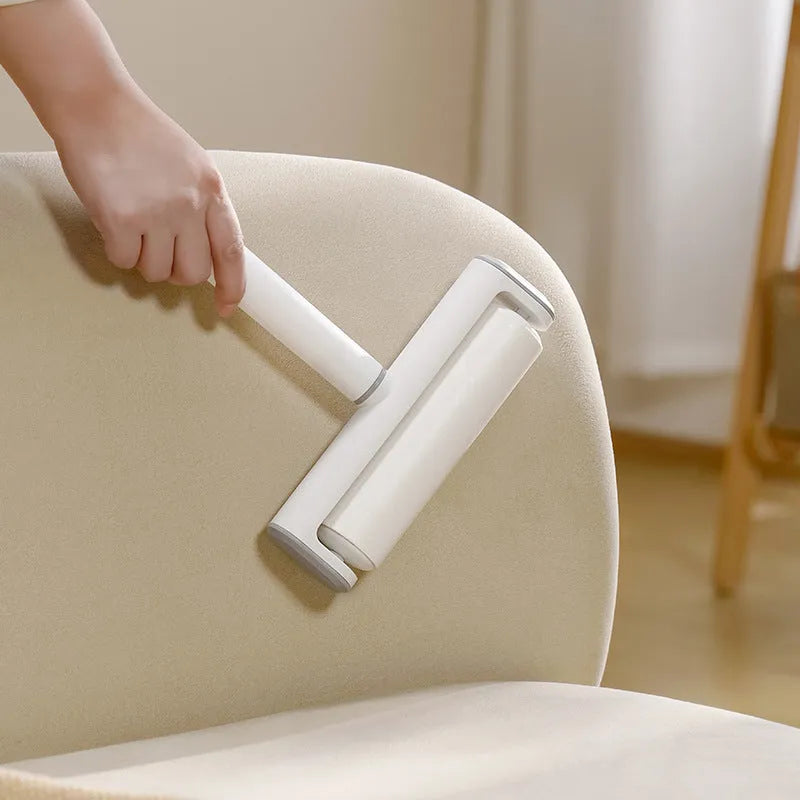 Lint remover roller pet tool with four replaceable adhesive cores for cat hair and dust removal.