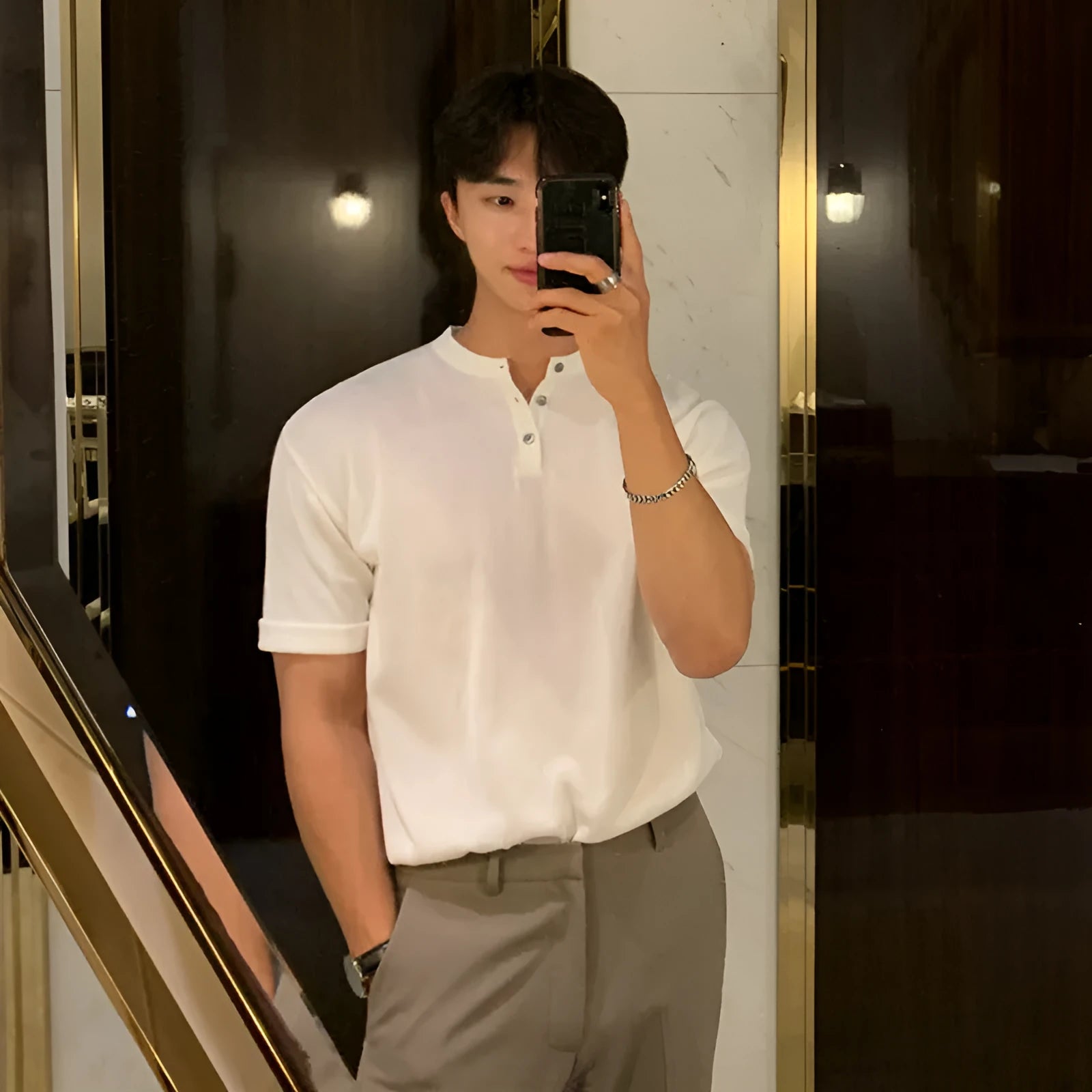 Men's black slim-fit short-sleeved ice silk knitted shirt on a hanger