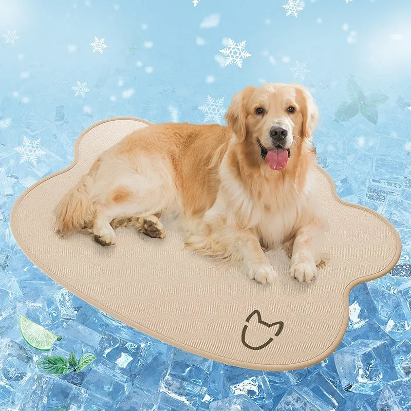 Dog head shaped ice silk cooling mat for pets in grey, green or rice colours on a wooden floor