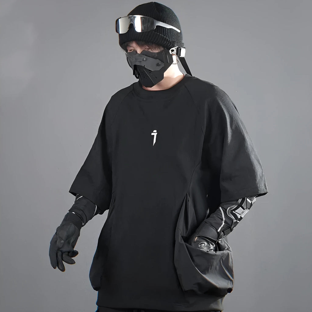 Men's loose grey cotton T-shirt with large front pockets and short sleeves.