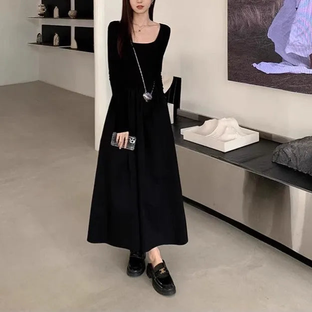 Black square collar knitted A-line dress with elastic waist and long sleeves on a model
