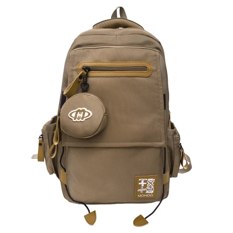 Large black waterproof nylon travel backpack with contrast stitching, shown with a 20-35L capacity.