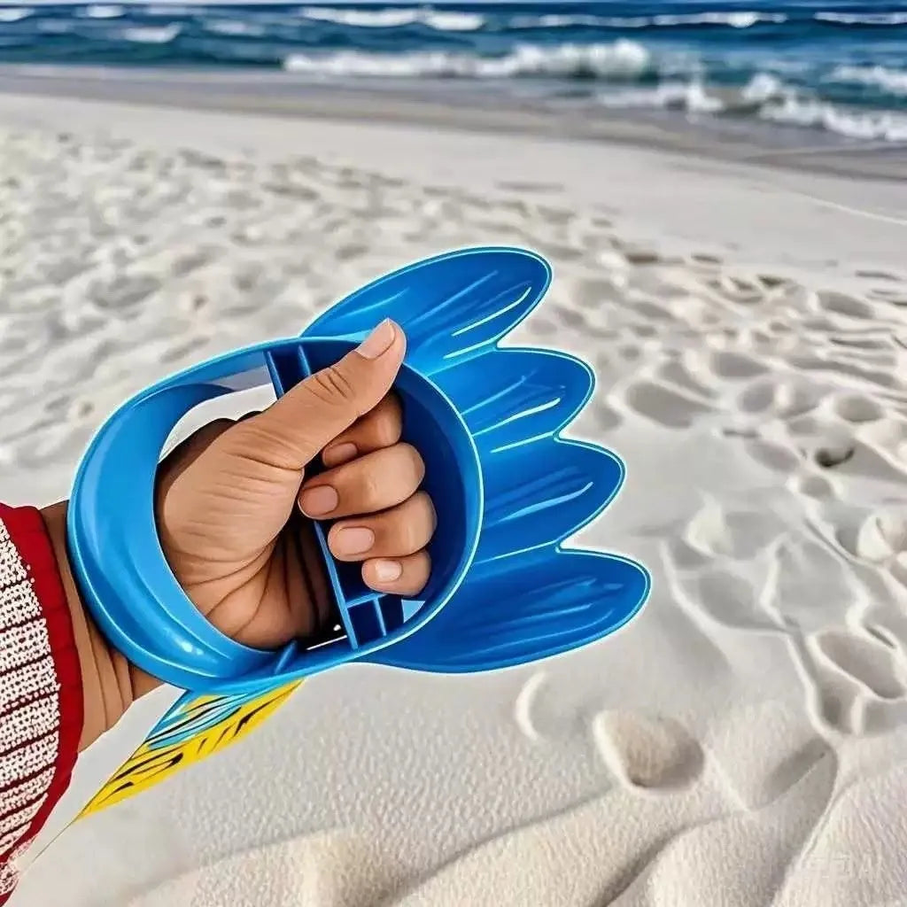 Two plastic sand digging shovels for children aged 4-6 years, set on a sandy surface near blue water.