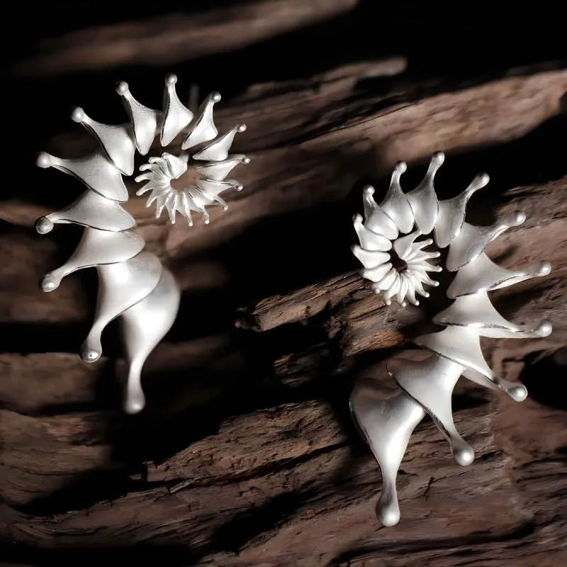 Three-dimensional matte finish conch shell stud earrings with exaggerated silhouette and simple styling