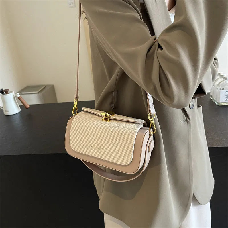 Women's black PU leather crossbody messenger bag with contrast stitching and lock detail