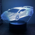 Black Sports Car shaped USB touch bedside lamp with remote control on a table.