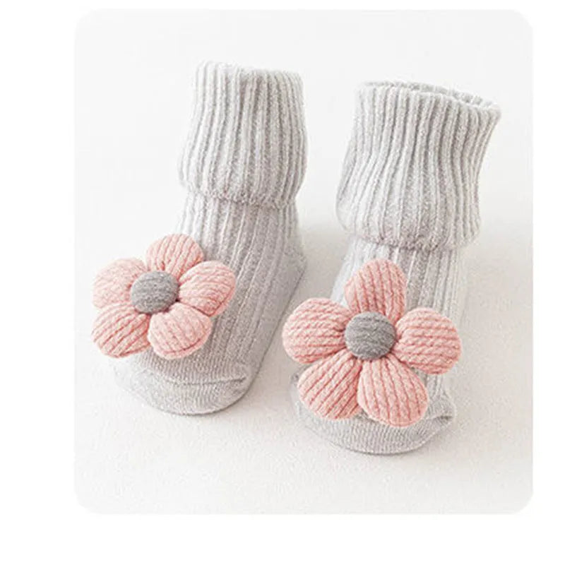 Cotton baby floor socks in multiple designs including panda, bow, and star patterns.