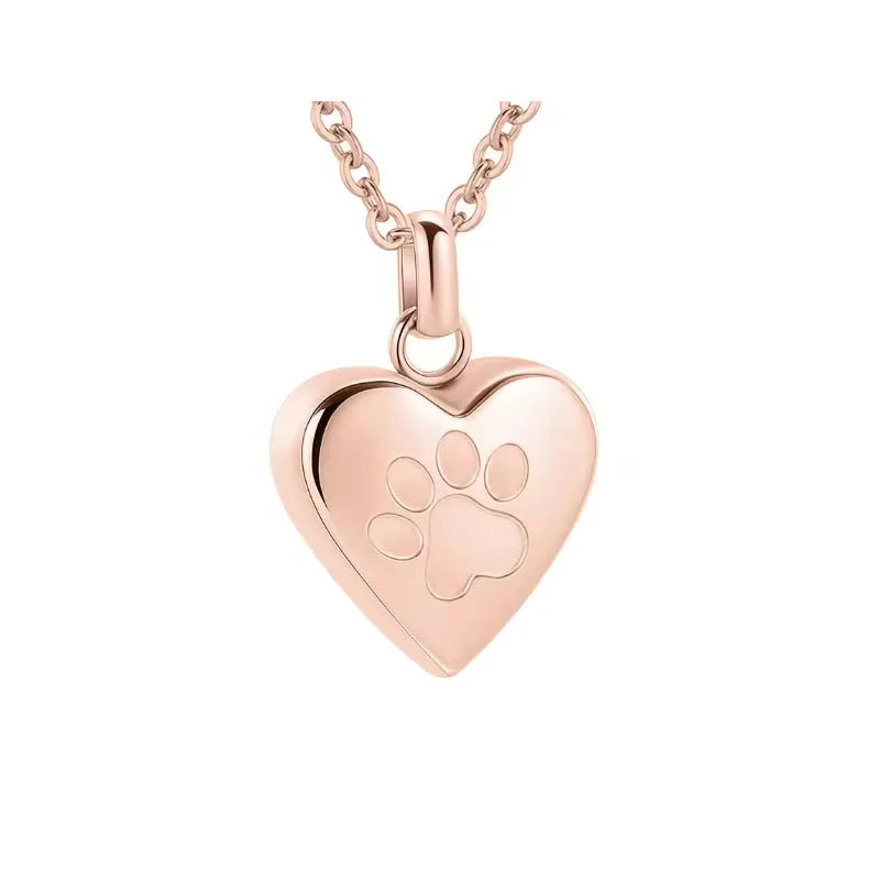 Silver heart pendant necklace with paw print design that opens as a casket.